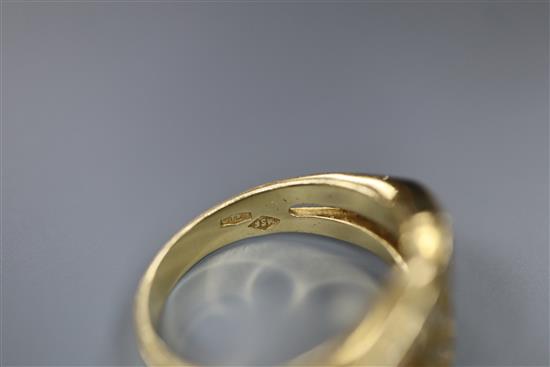 A modern 18ct gold and diamond set stylised buckle ring, size M, gross 7.8 grams.